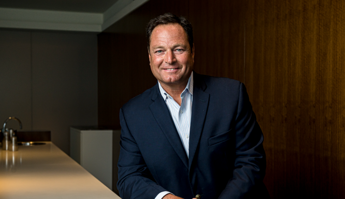 David Agnew posing in an office setting.