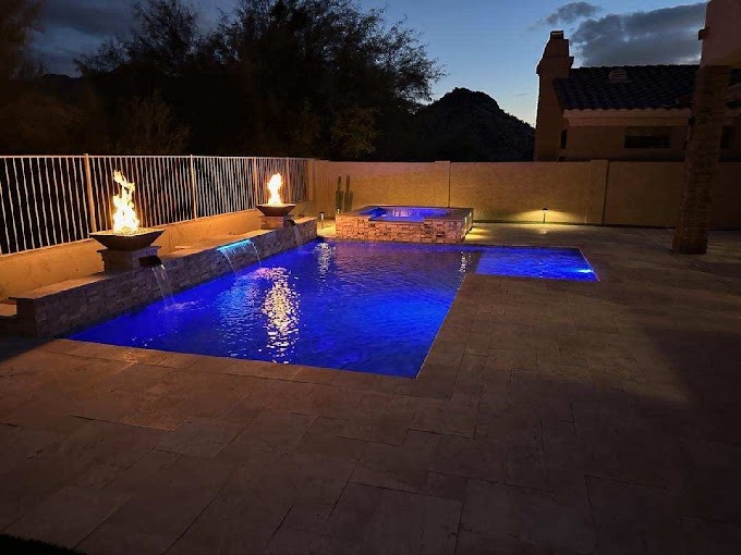 ✨ Luxury Pool Remodel with Fire & Water Features in Scottsdale ✨

This stunning evening shot showcases a high-end pool remodel featuring custom spillways that create a serene waterfall effect. The elevated spa with fire pot features adds a dramatic, resort-style ambiance, while vibrant LED lighting highlights the pool’s modern design. Perfectly blending fire, water, and light, this Scottsdale backyard transformation is a masterpiece of luxury outdoor living.