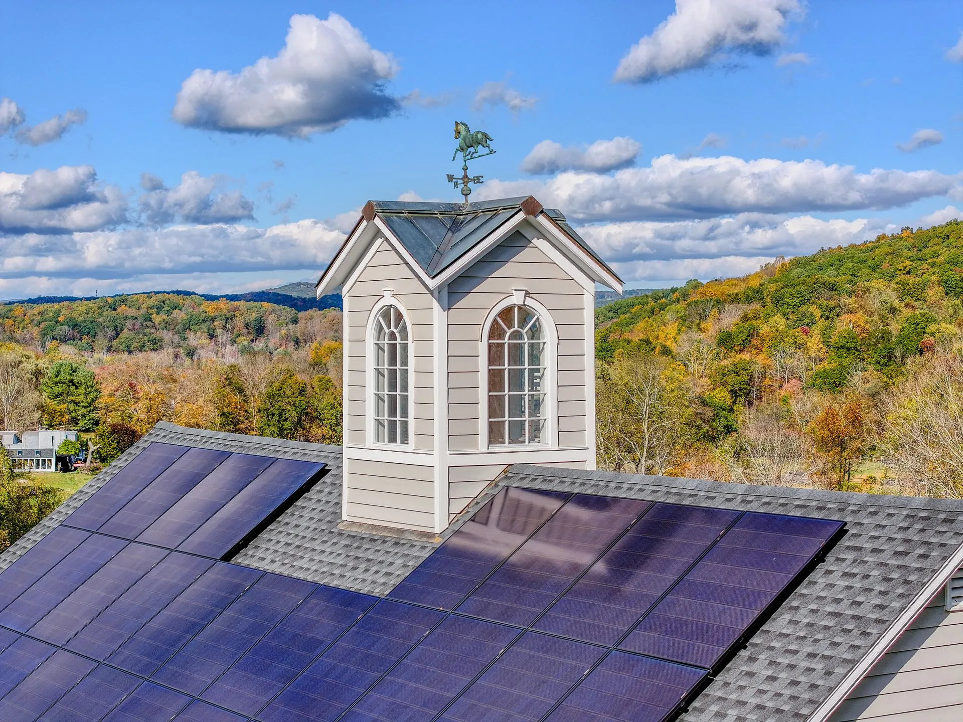 Aerial view of a residential rooftop solar array
