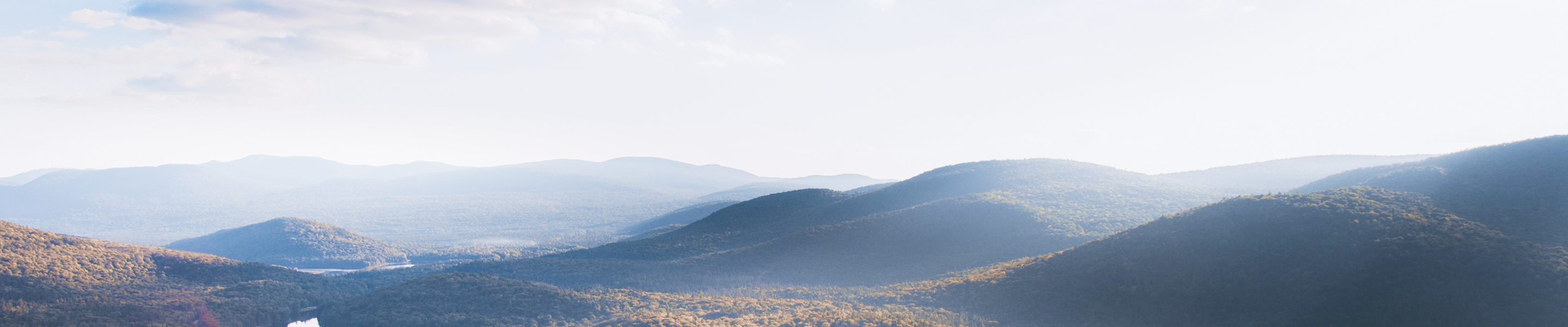 Picturesque rolling hills on a partly sunny day.