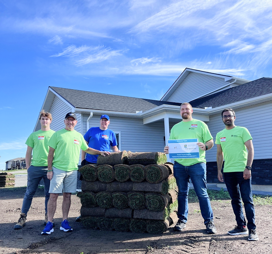 A photo of Empringham Bridger team volunteering in support of Habitat for Humanity.