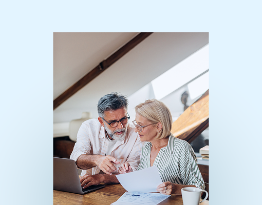A husband and wife reviewing their finances together.