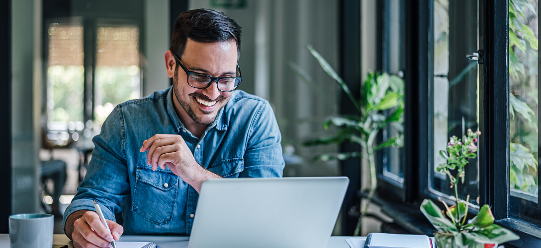 A client looking over their account on their laptop.