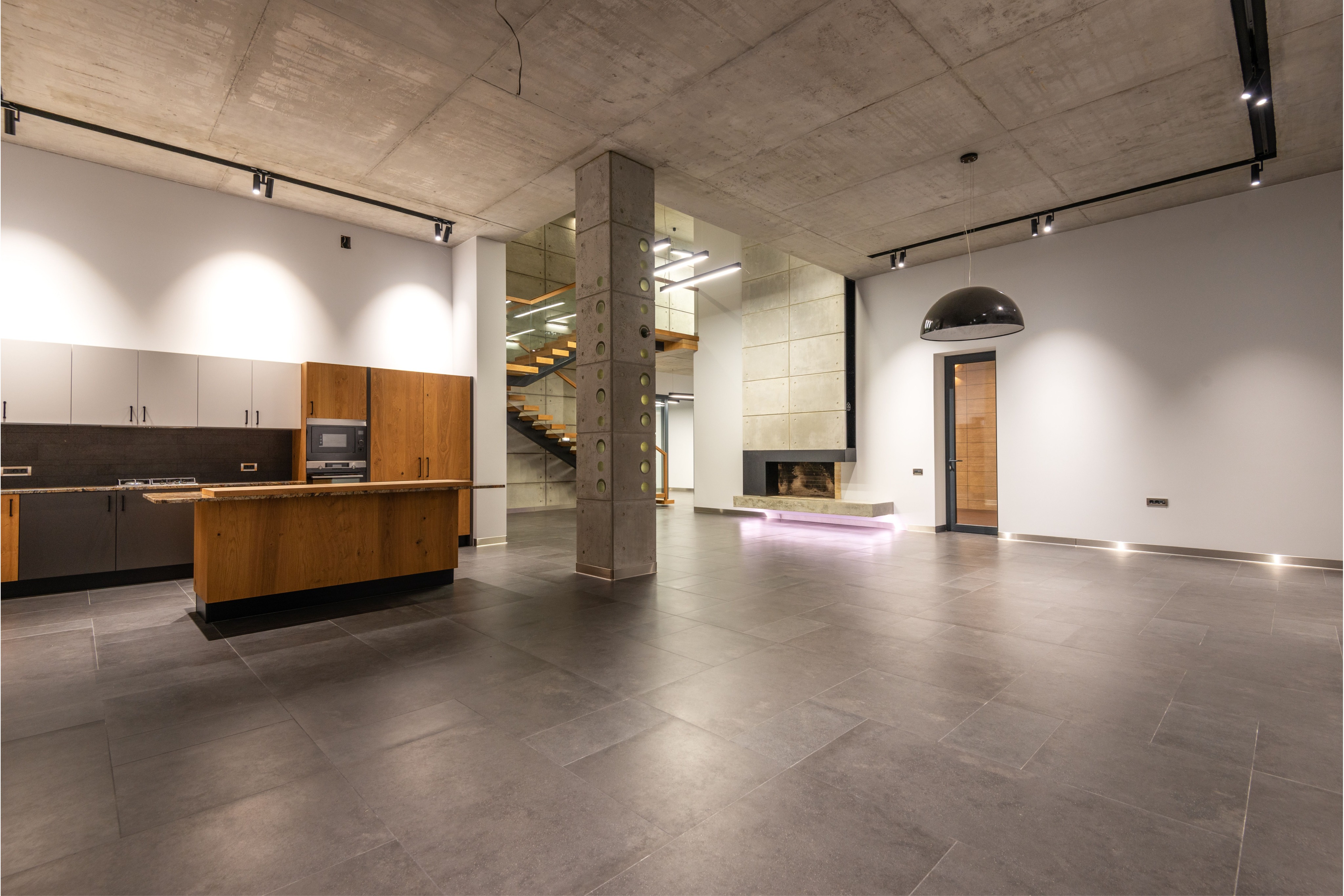 Modern open-concept interior showcasing clean, professionally finished walls and crisp painted surfaces. This image represents Crest & Crown LLC’s interior painting services for residential and commercial spaces.
