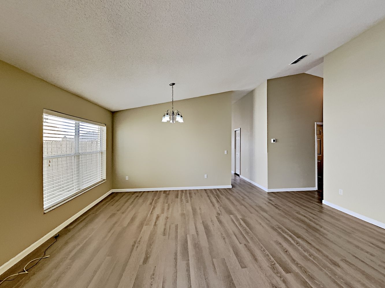 Dining nook with upgraded flooring at Invitation Homes Orlando.