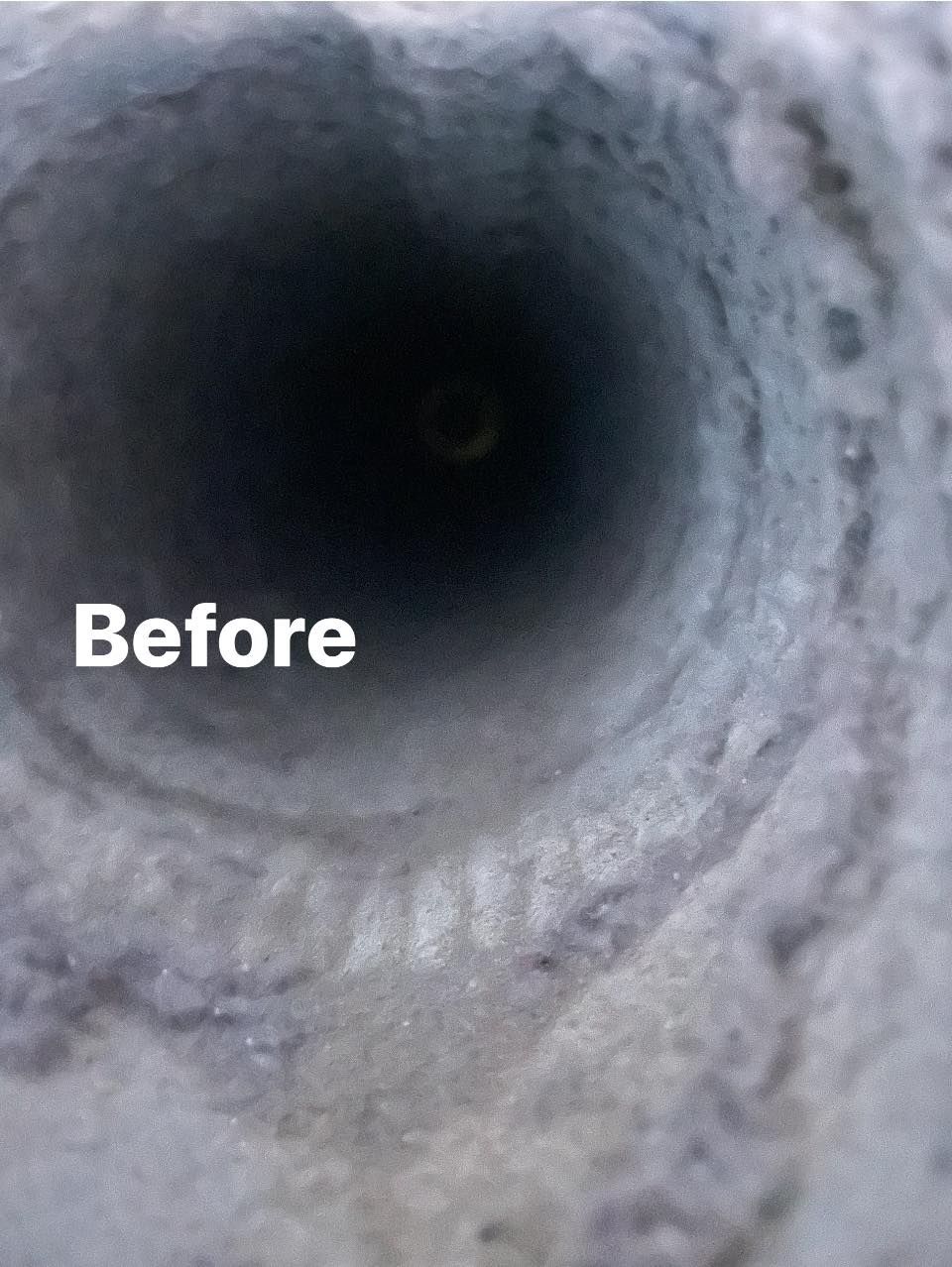 Before-cleaning view inside a residential ventilation duct showing dust and debris buildup. Upfront Home Inspection & Maintenance provides professional duct and vent cleaning services throughout Southern and Central Maine.