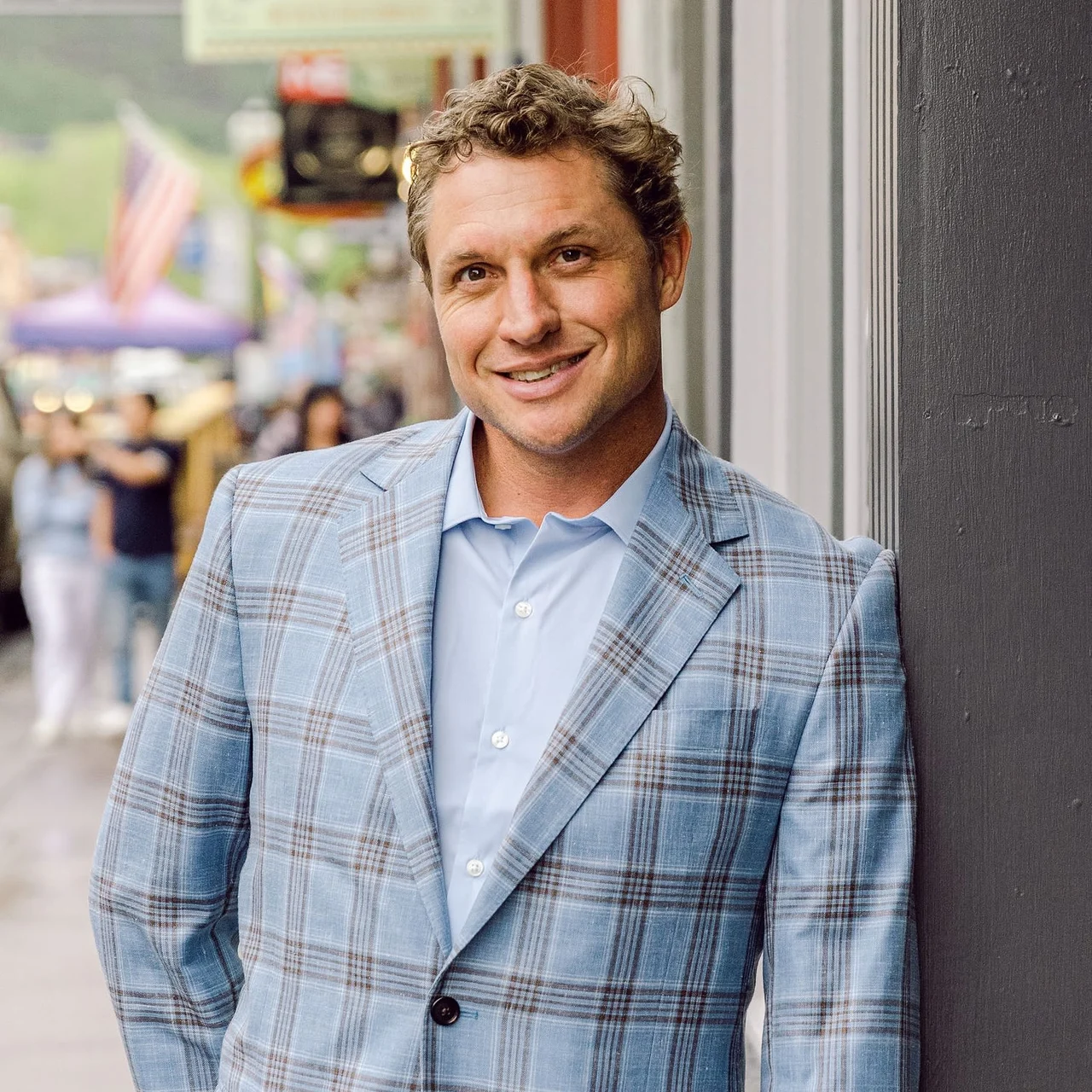 Andrew "Drufur" Williamson, co-principal of JW Group, wearing a plaid blazer.