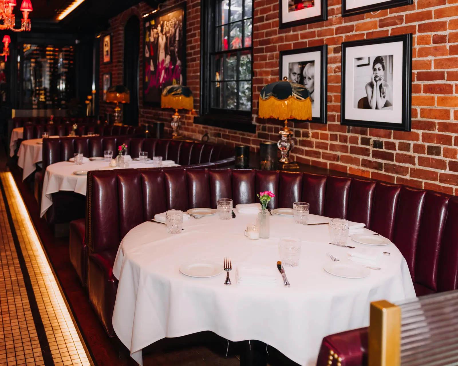 Row of circular banquette tables inside Cento Italian restaurant