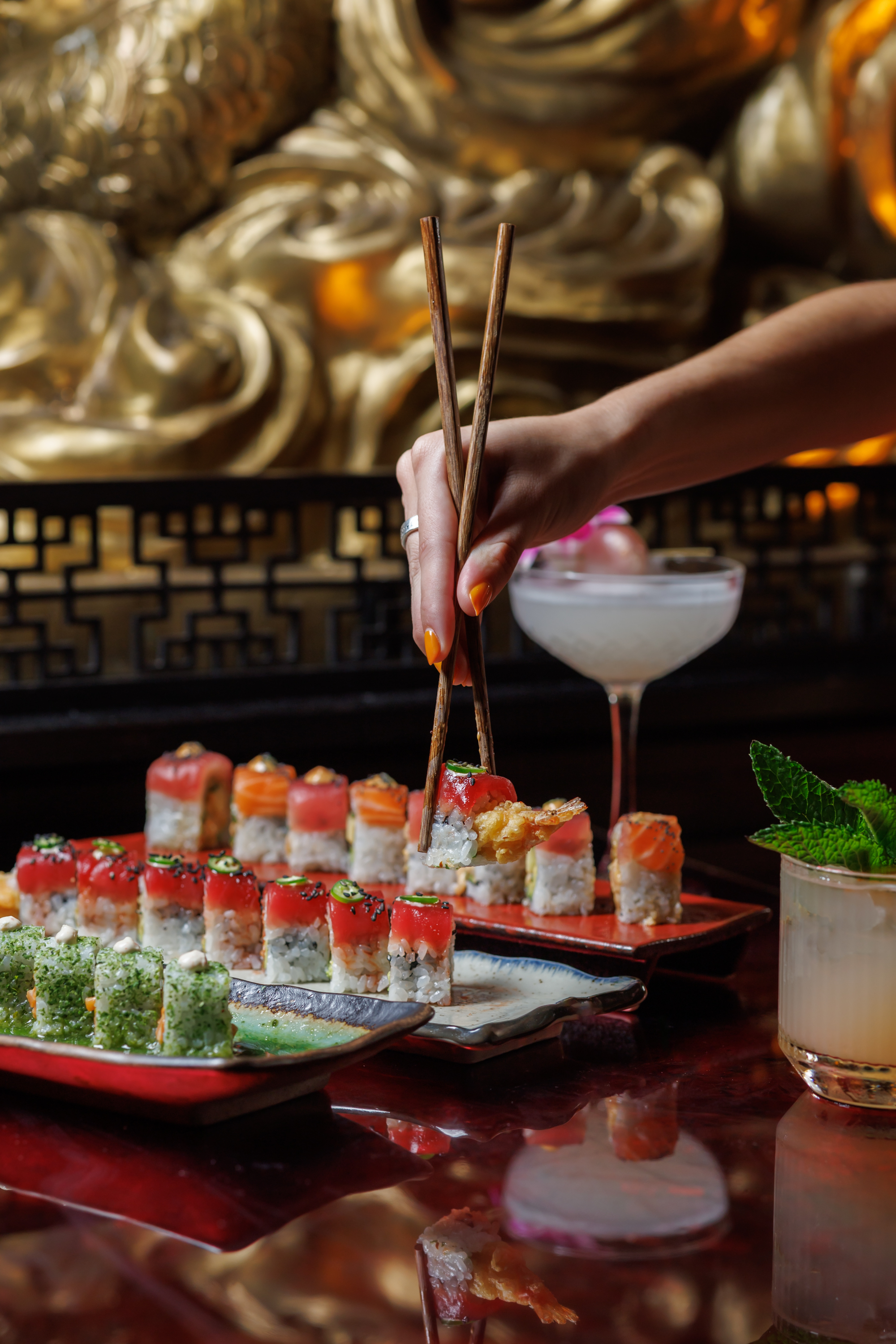Discover signature sushi and cocktails at Mr. H in Boston’s Seaport District, featuring the Lychee M 