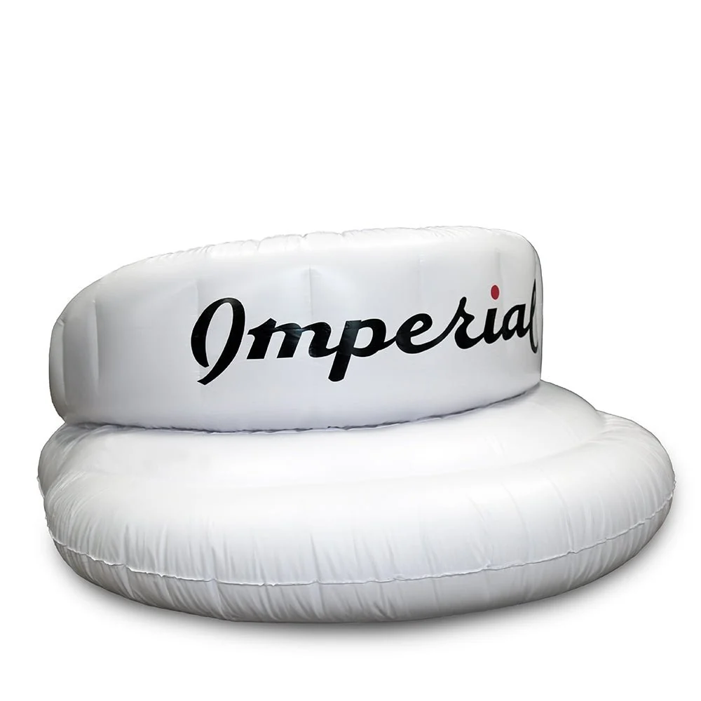 The Imperial Tour Visor&reg; Pool Float - the visor silhouette blown up to pool scale, with a raised crown backrest.