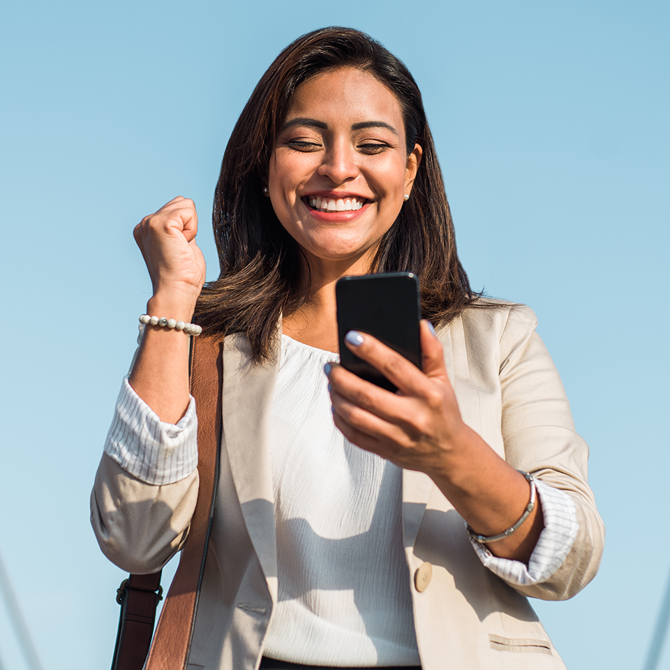 Happy woman looking at a phone