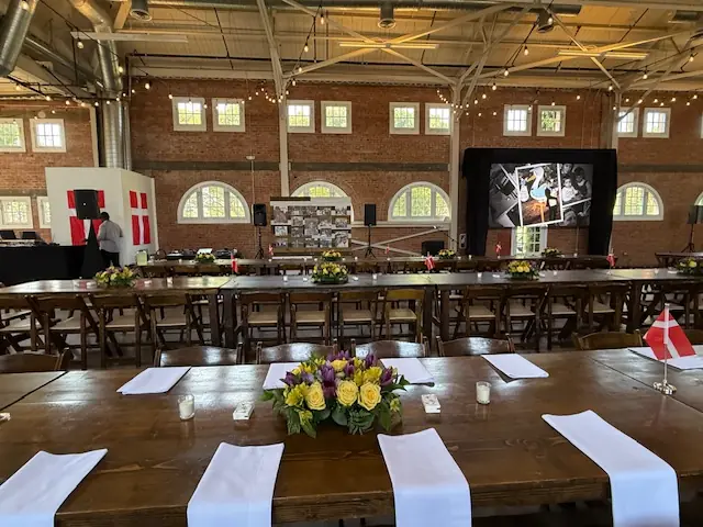 Floral arrangements and memory tables styled for a loved-one’s celebration