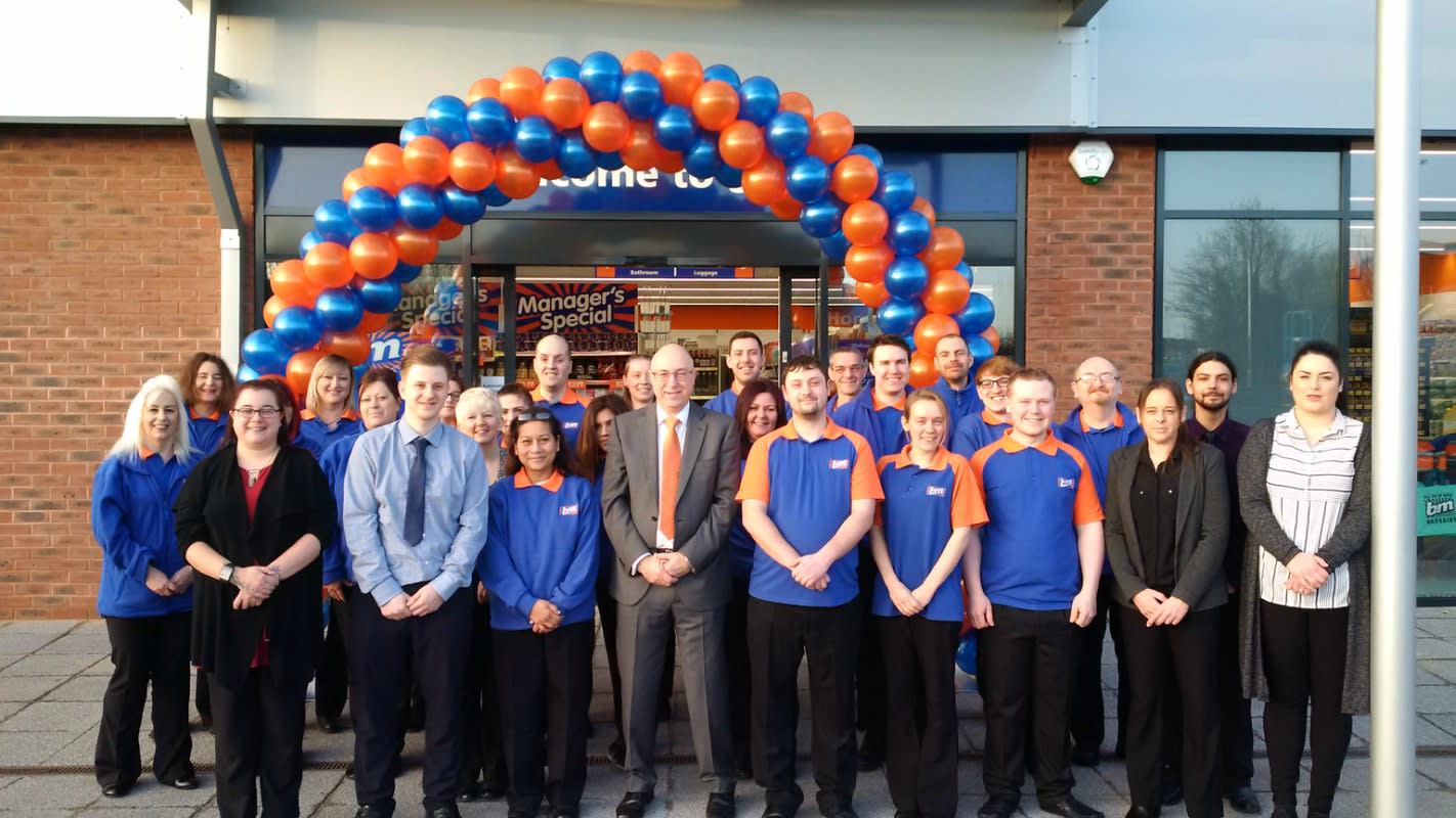 B&M staff pose outside their brand new store in Broomhall, located on Bath Road.