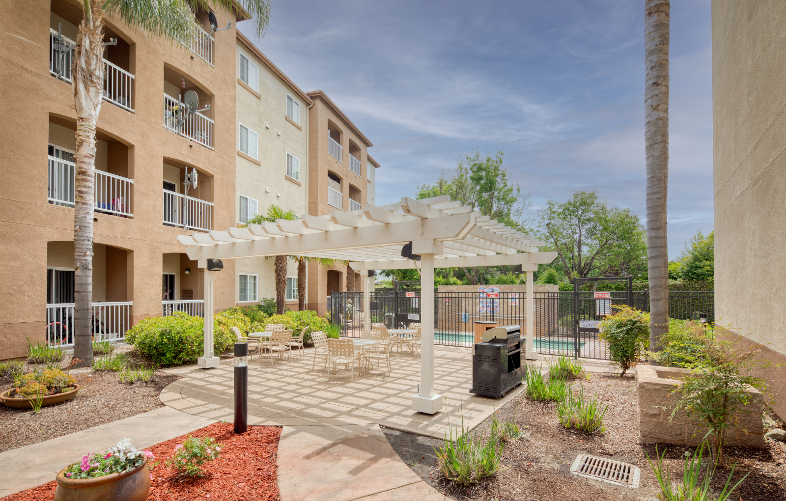 Courtyard with Covered Seating at Hayward Village Senior Apartments in Hayward, CA