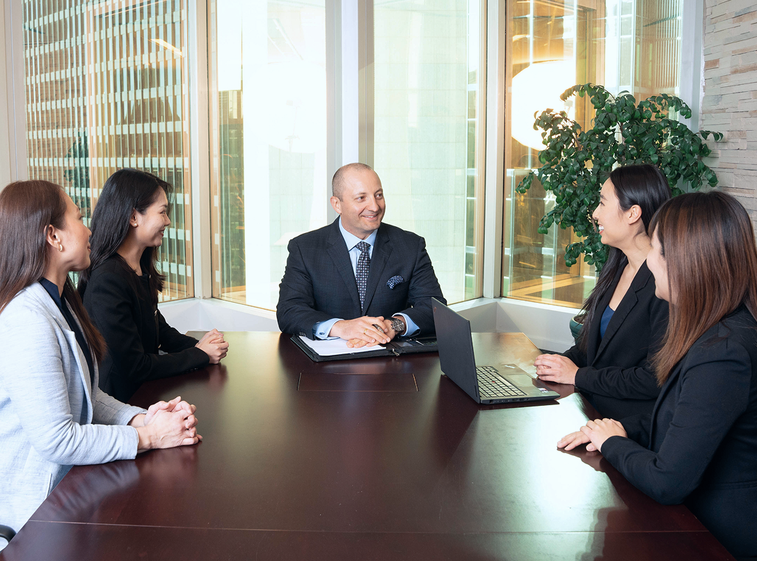 George Manjgaladze and team around a boardroom table.