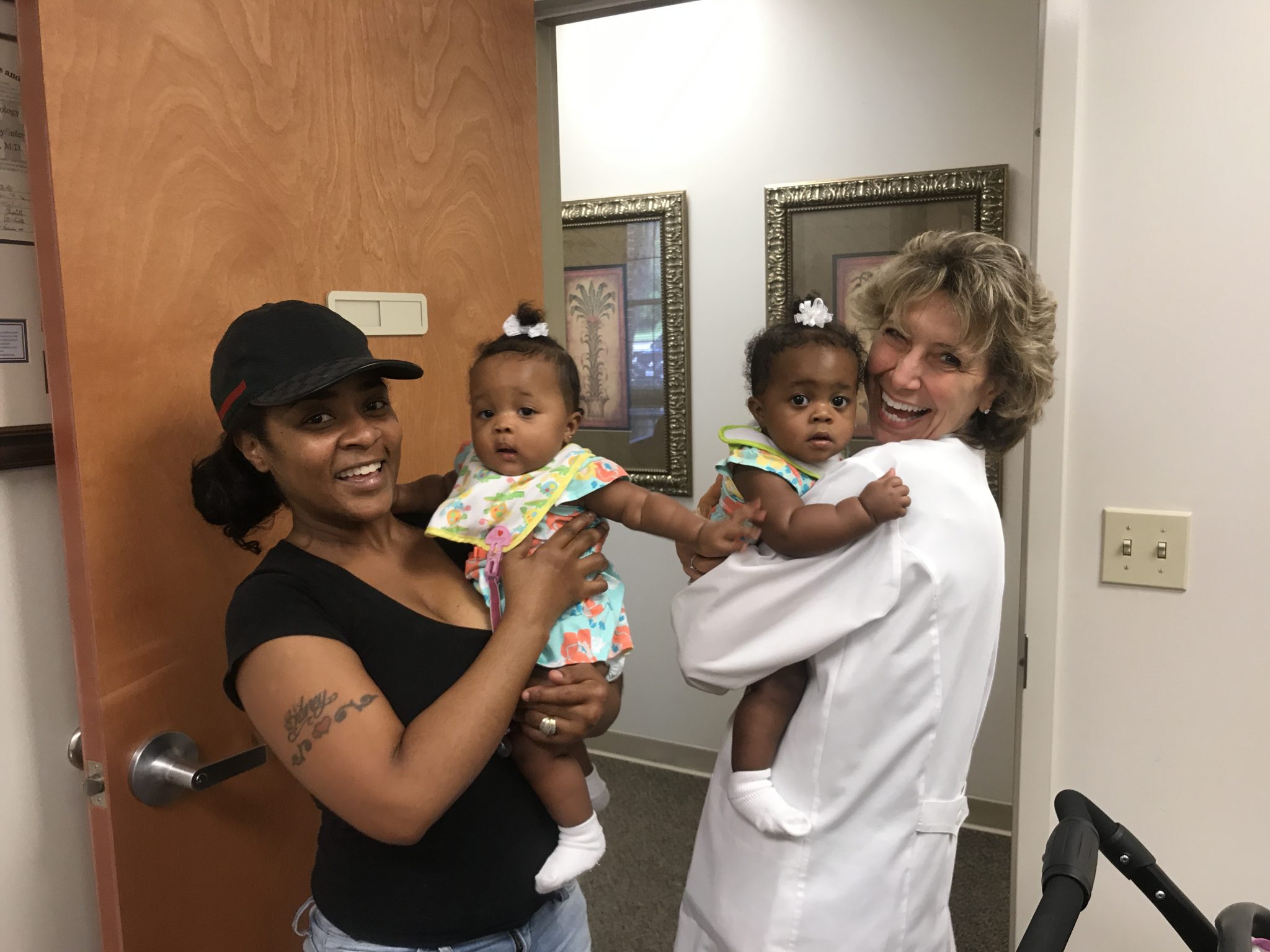 Dr. Sandy Goodman with twin babies.