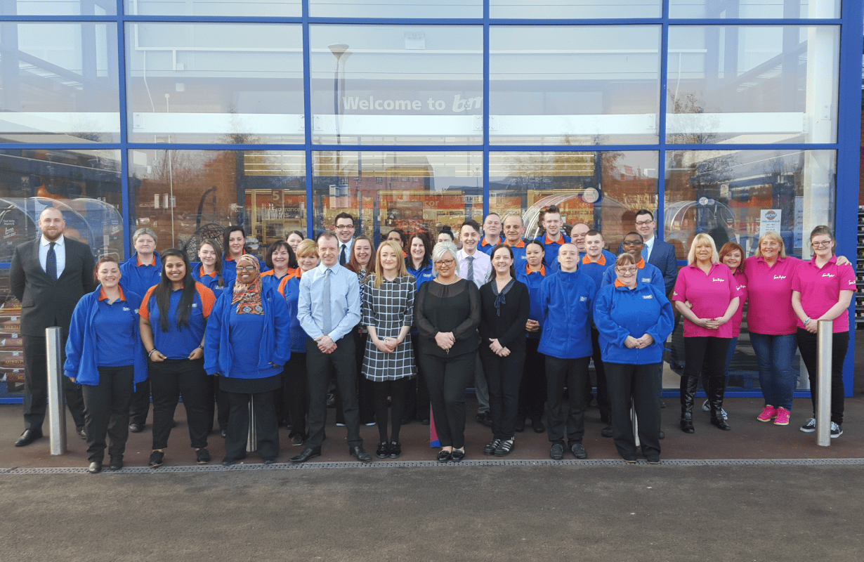 Store staff pose outside their new B&M Homestore at the Castle Retail Park, Nottingham