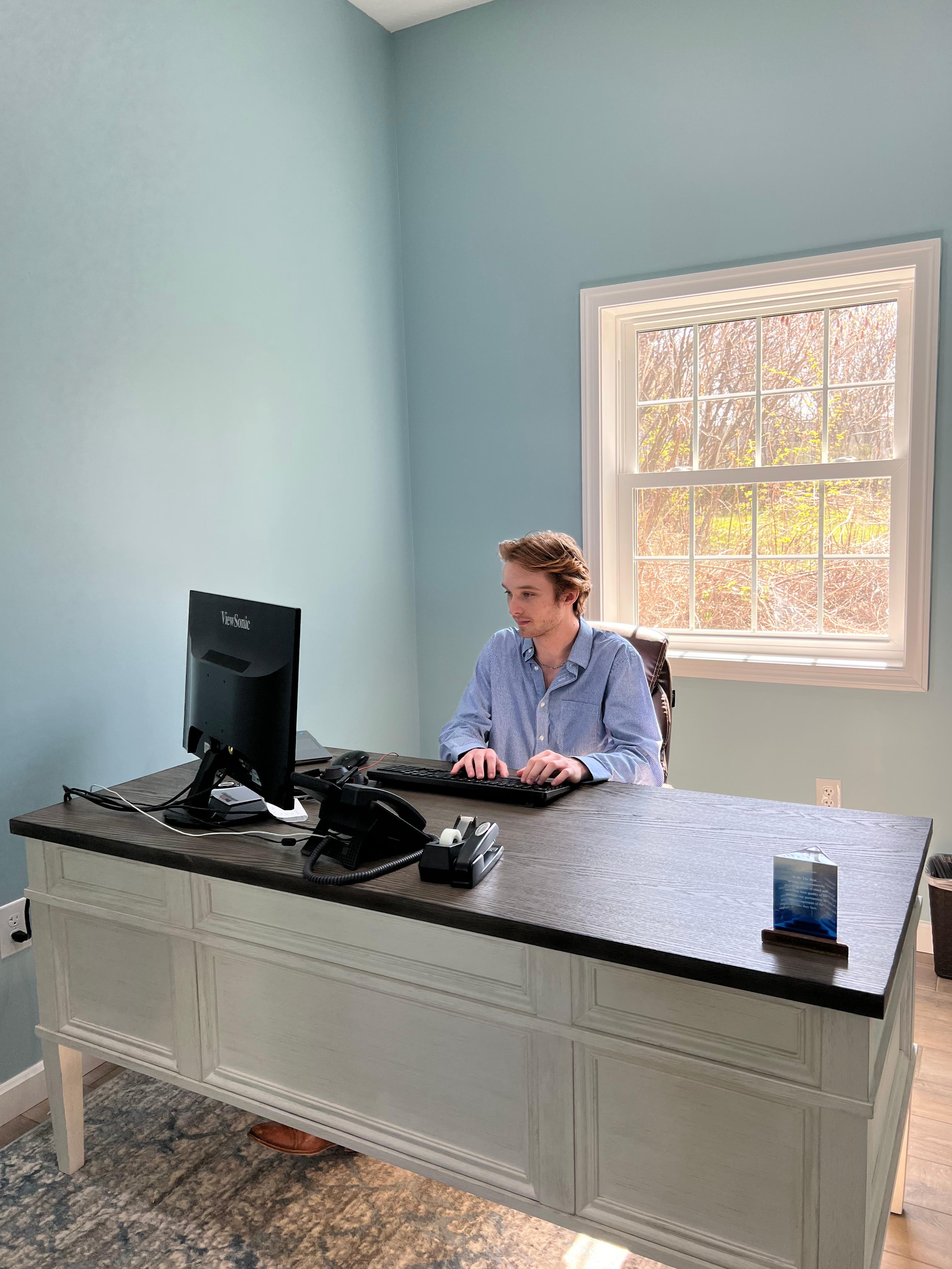 Collin at his desk