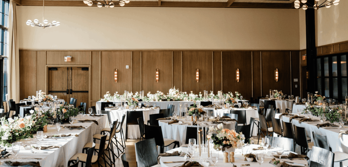 A wedding reception set in the Franklin Gallery ballroom at The Junto in downtown Columbus. 