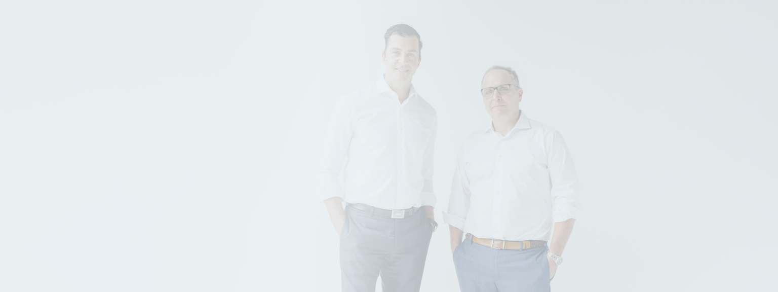 Jeffrey Wellwood and Matt Barasch standing side by side.