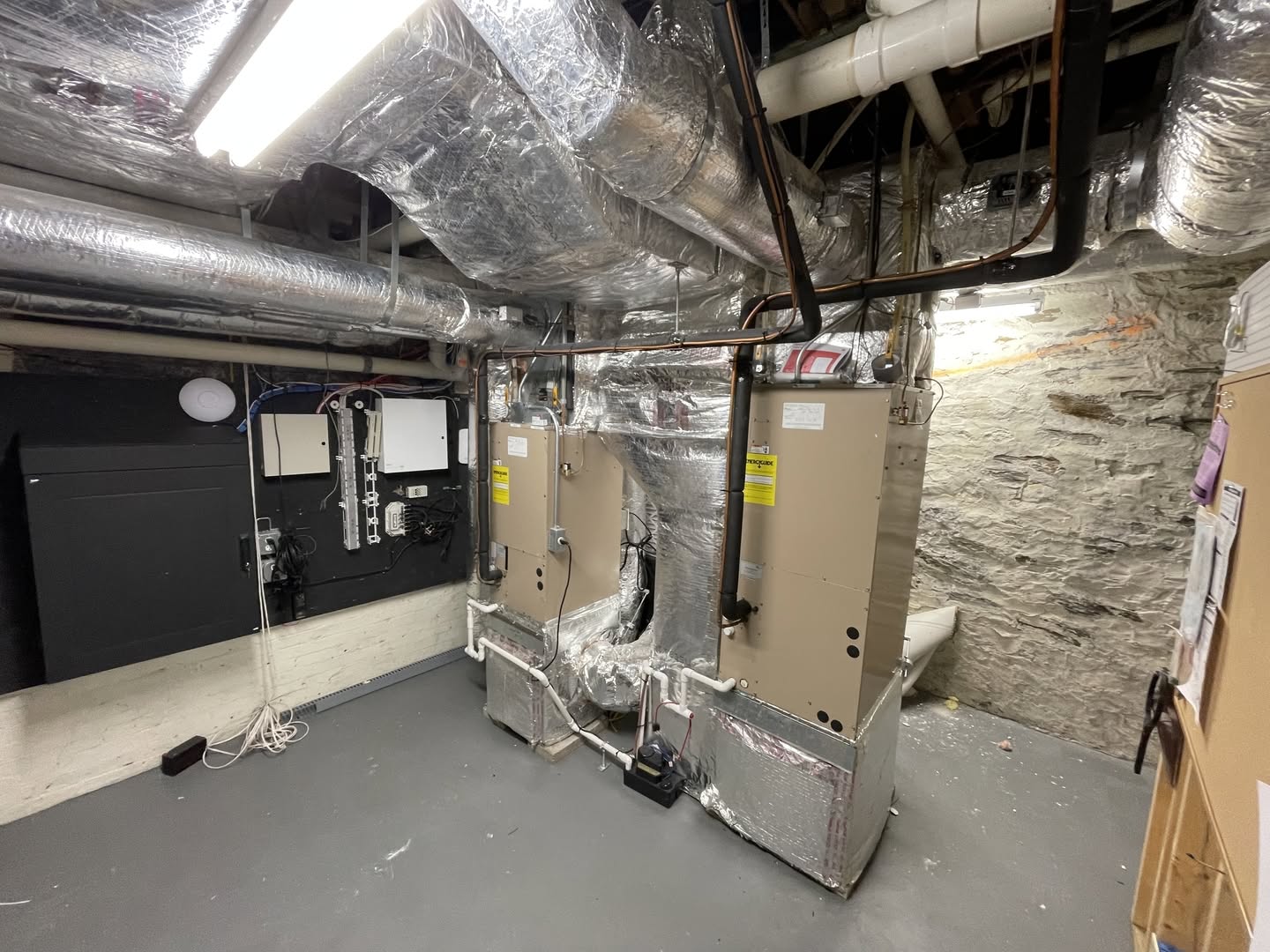 Residential HVAC system and insulated air ductwork photographed during a home inspection. Upfront Home Inspection & Maintenance provides professional home inspections, air duct cleaning, and preventative home maintenance services throughout Southern and Central Maine.