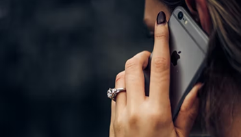 Close-up shot of a woman on her cell phone.