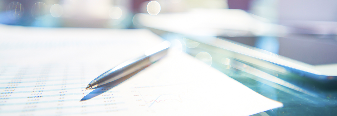 Close-up of a pen on top of a document.