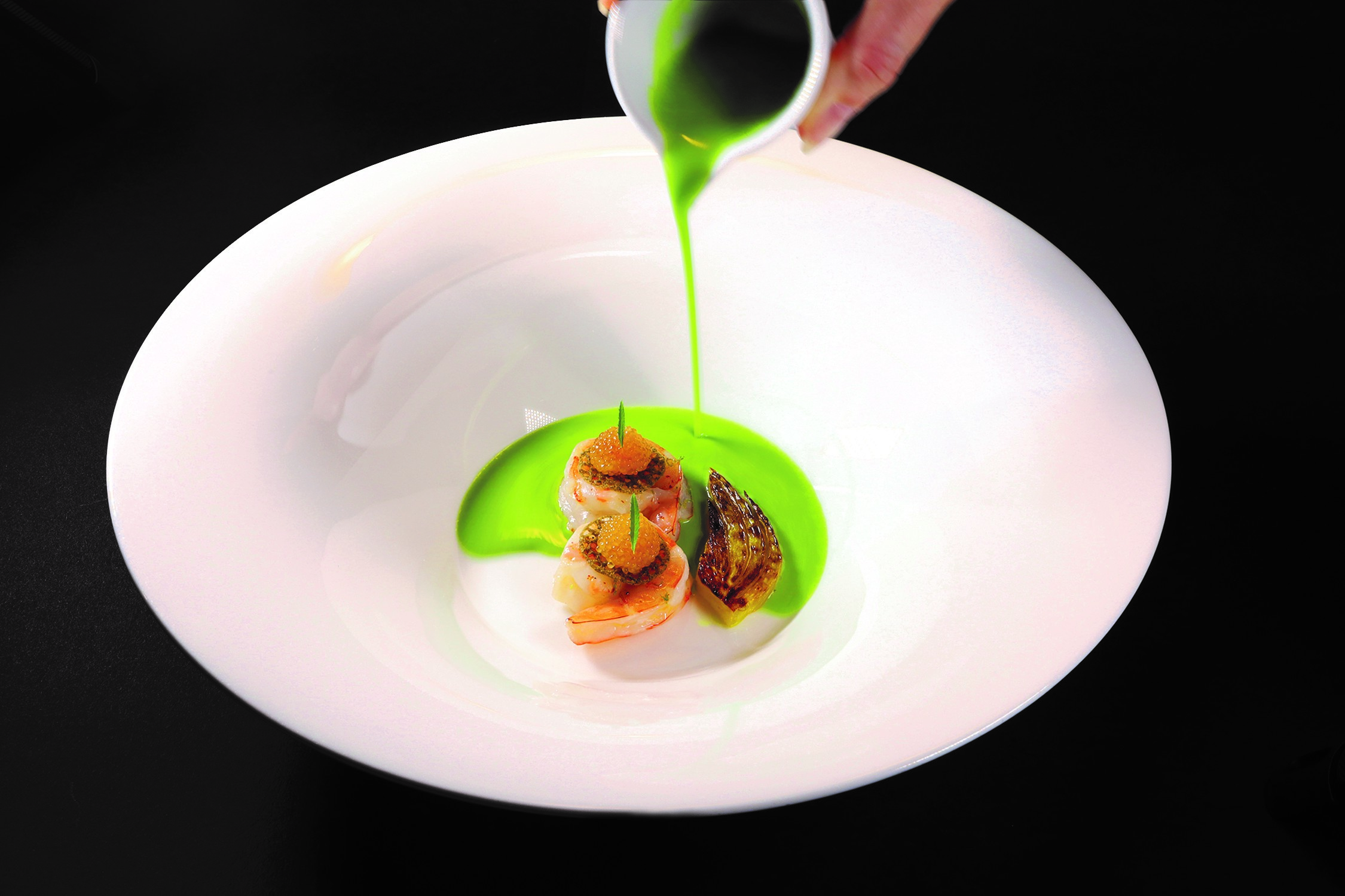 Scallop, lightly smoked, with gold ossetra caviar and champagne hazelnut. One of the most consistent courses on Chef Christophe Bellanca's menus at Essential by Christophe.