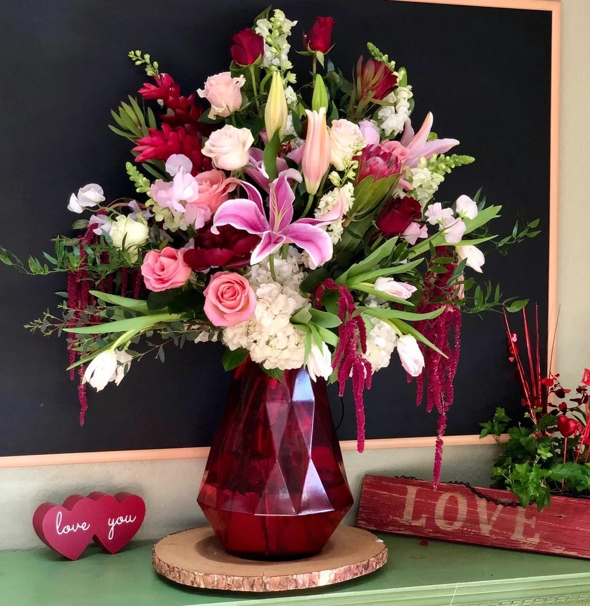 Velocity - A Luxury sized arrangement designed with a rush of Ginger Flower, Stargazer Lilies, Epic Roses, Hydrangeas, Hanging Amaranthus,  and Tulips