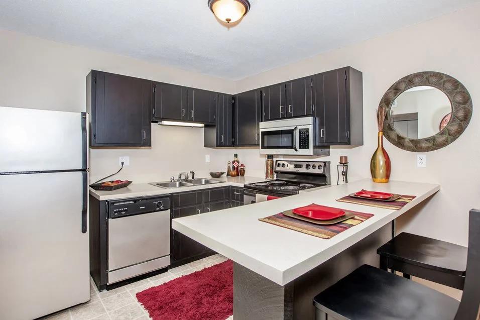 Kitchen with wooden cabinet Preston Court Apartments, Kansas