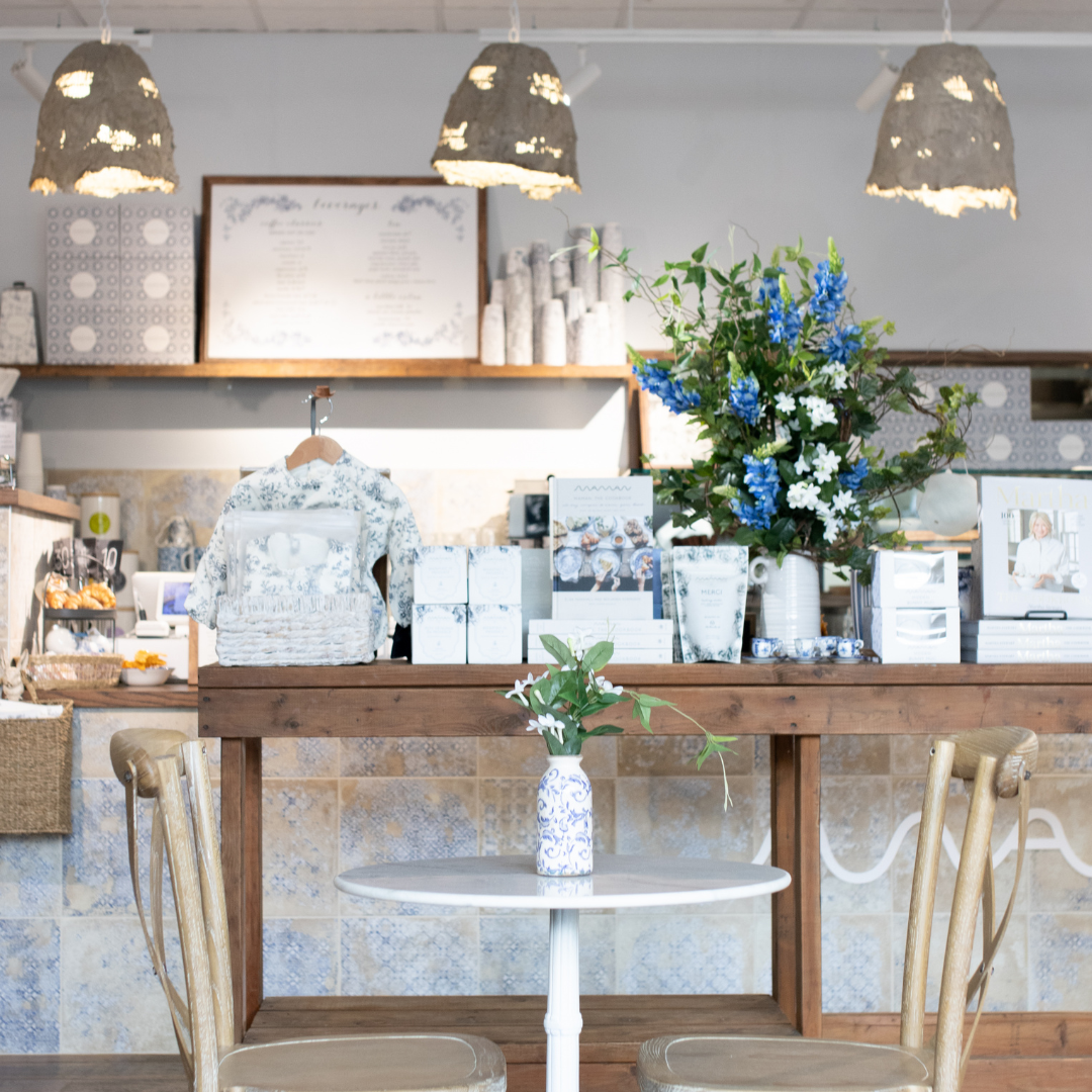 A retail display inside maman Park Cities showcases curated gifts, coffee, and home goods surrounded 