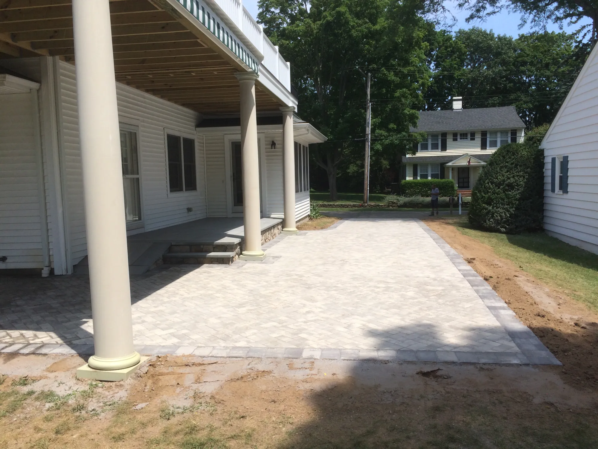 Backyard paver patio entertaining space - Patios project by General Masonry LLC.
