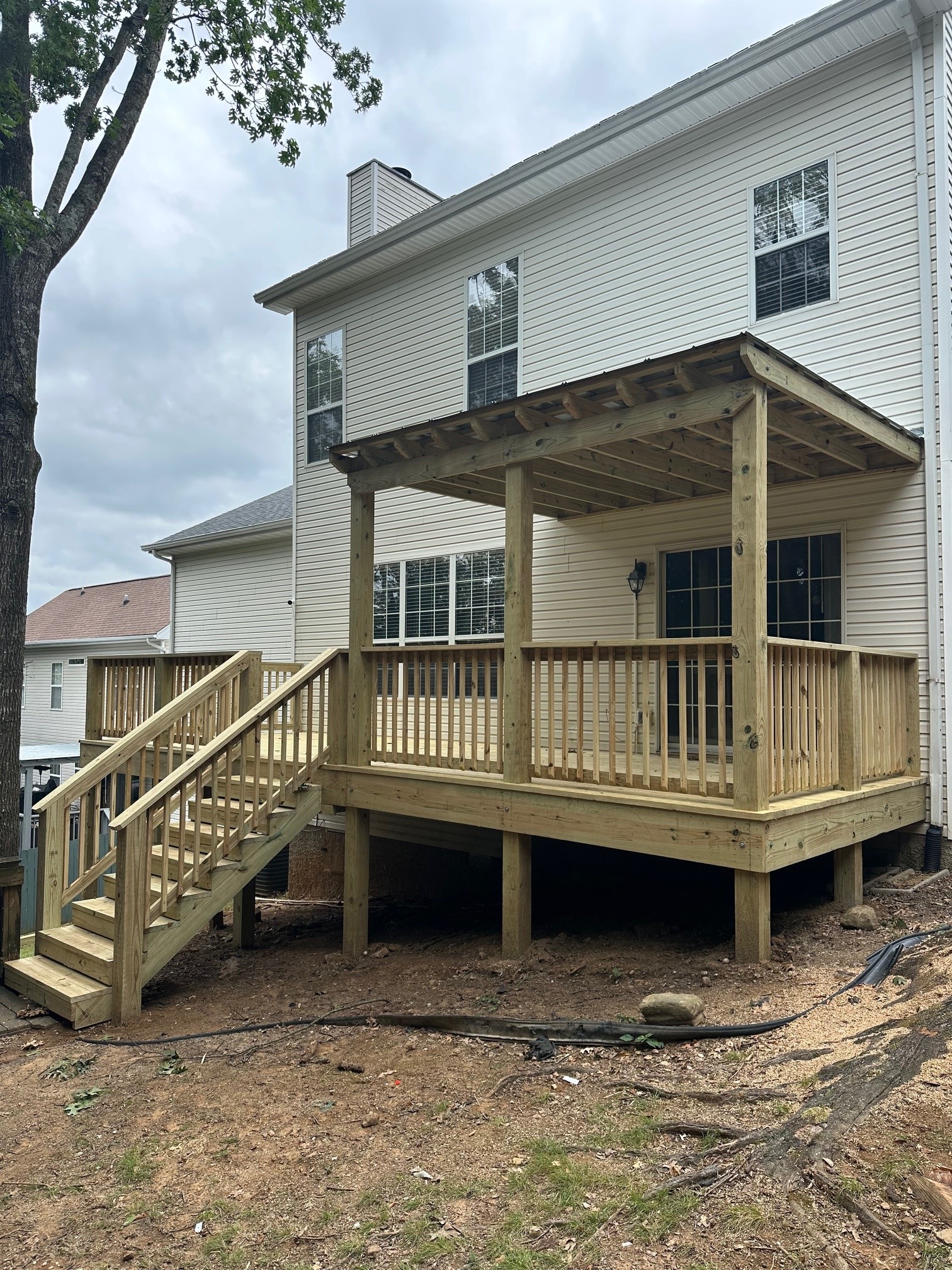 wood deck and stairs with metal roofing cover