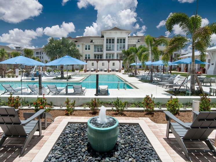 Pristine Landscaping, Bright Exterior and Inviting Amenities Welcome You at The Edison Apartments