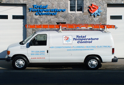 Total Temperature Control white work van with logo on the side outside parked on sidewalk in front of work building