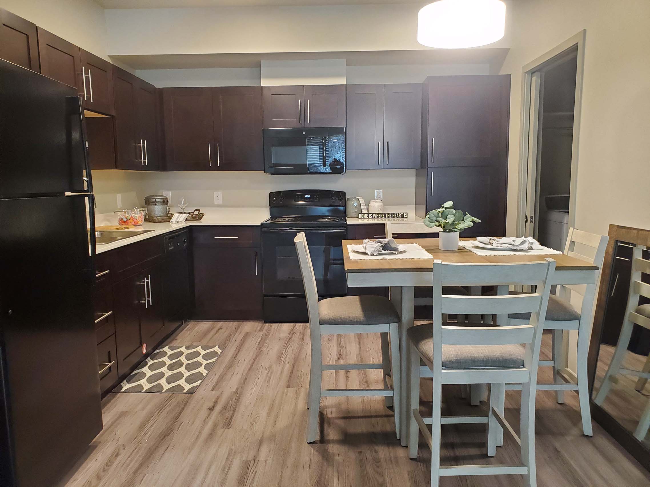 Modern kitchen with dining area and wood flooring