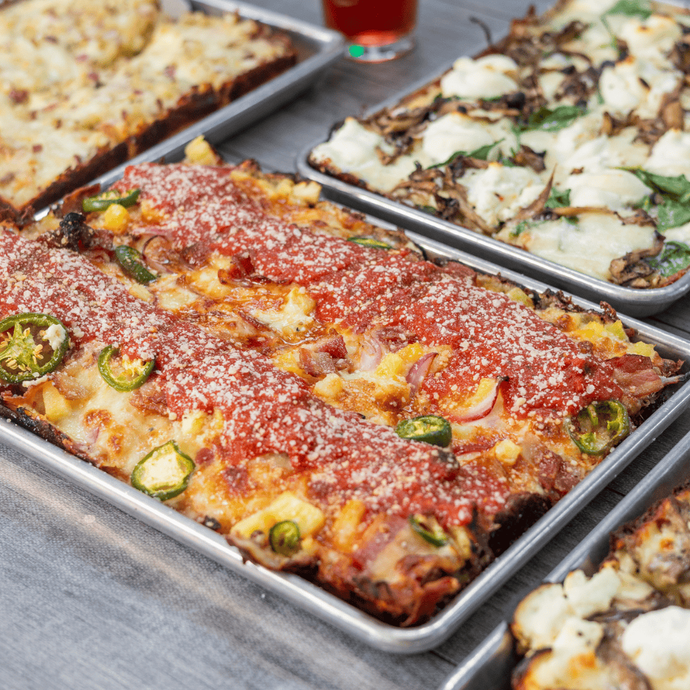 Ghost Box Pizza serves authentic Detroit-style pizza featuring crispy edges, quality ingredients, and signature square slices.