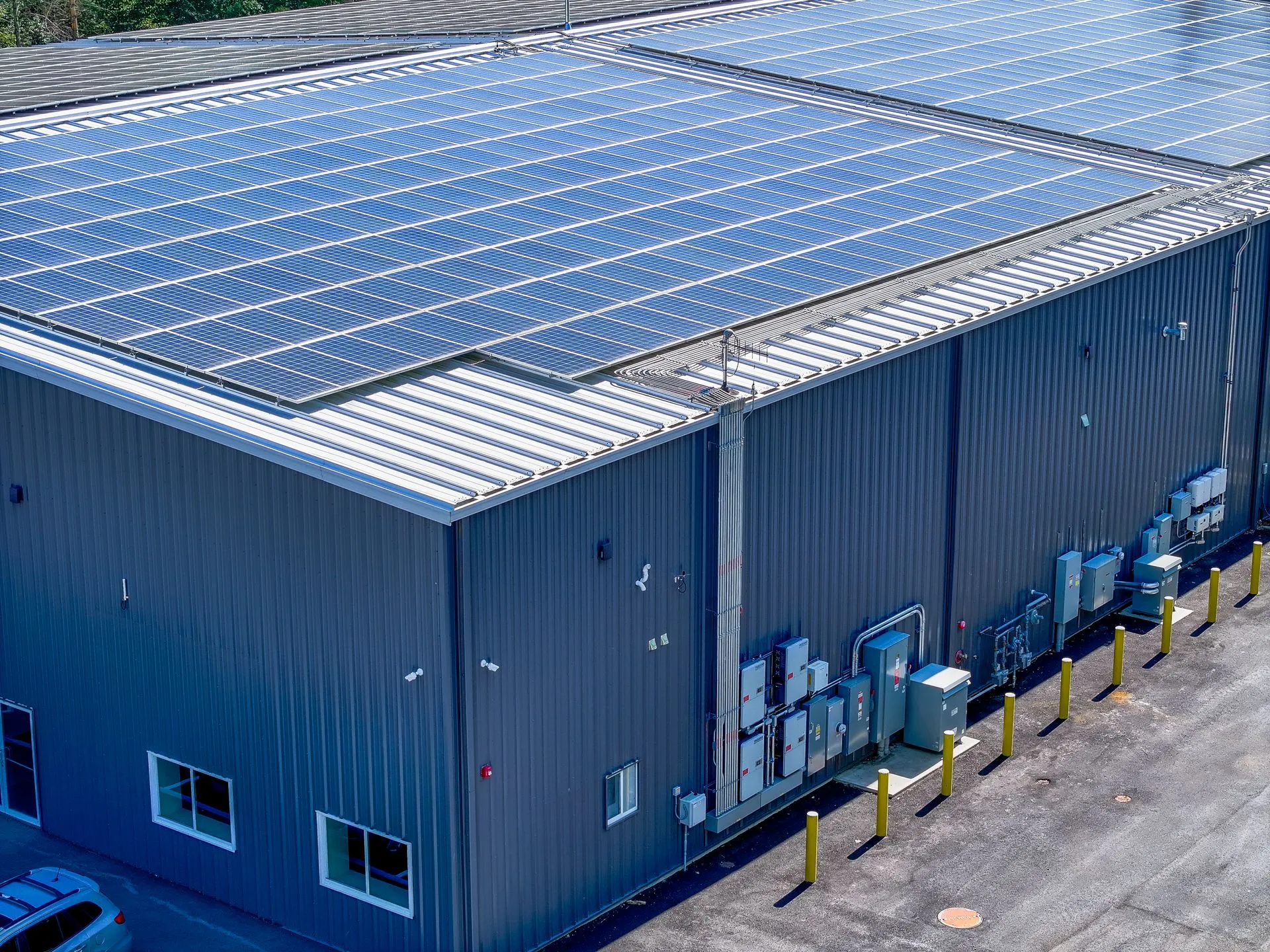 Industrial warehouse with a large commercial rooftop solar array