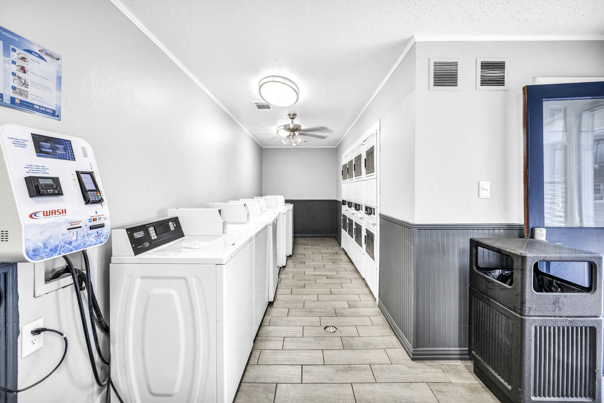 Laundry room with a bunch of machines 