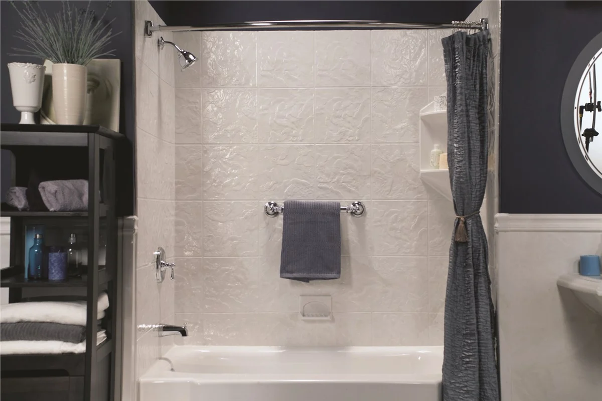 Bathtub and shower combination installed by Luxury Bath featuring wall surround panels, updated fixt 