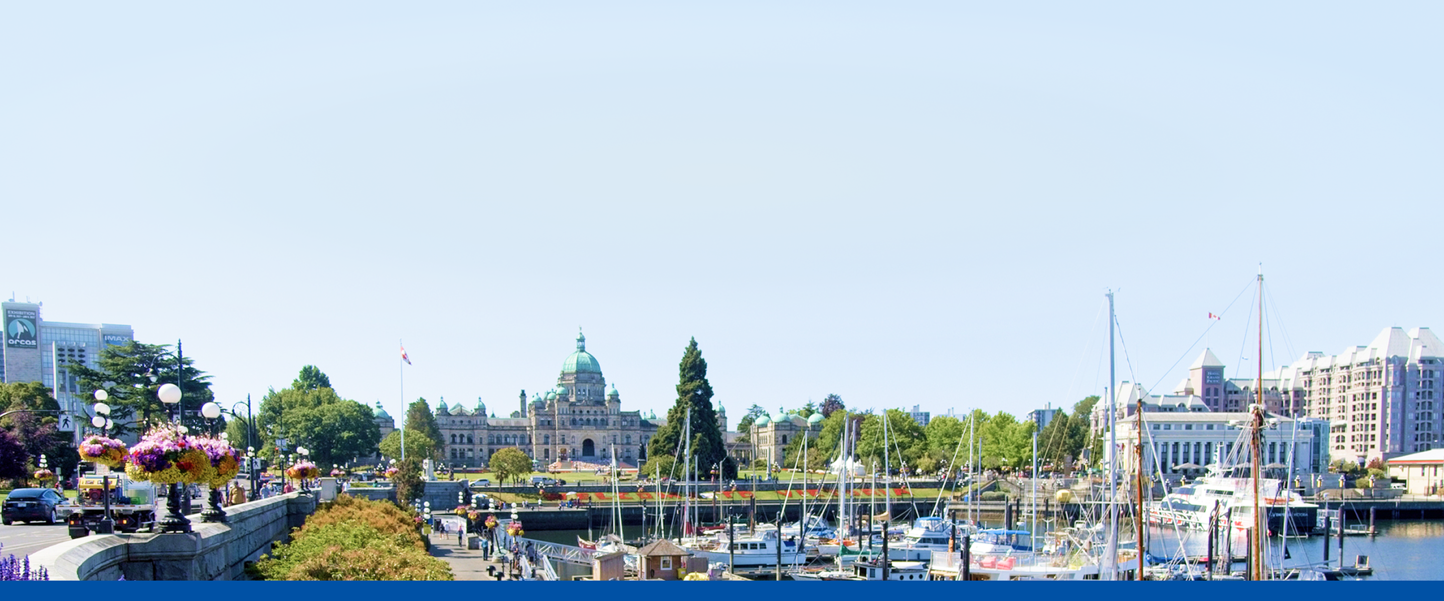 View of the BC Legislative Building and surrounding sights as seen from Victoria Harbour.