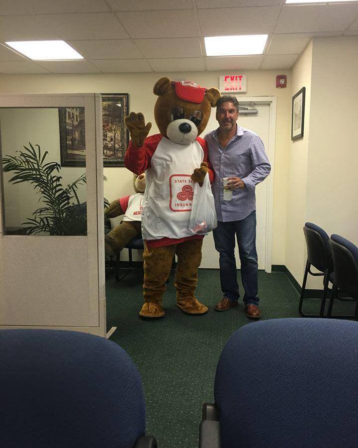 Standing strong in the office with a familiar friendly face. Always here to help our community with trusted guidance, personalized service, and support you can count on every day. Proud to serve you right here in the neighborhood!