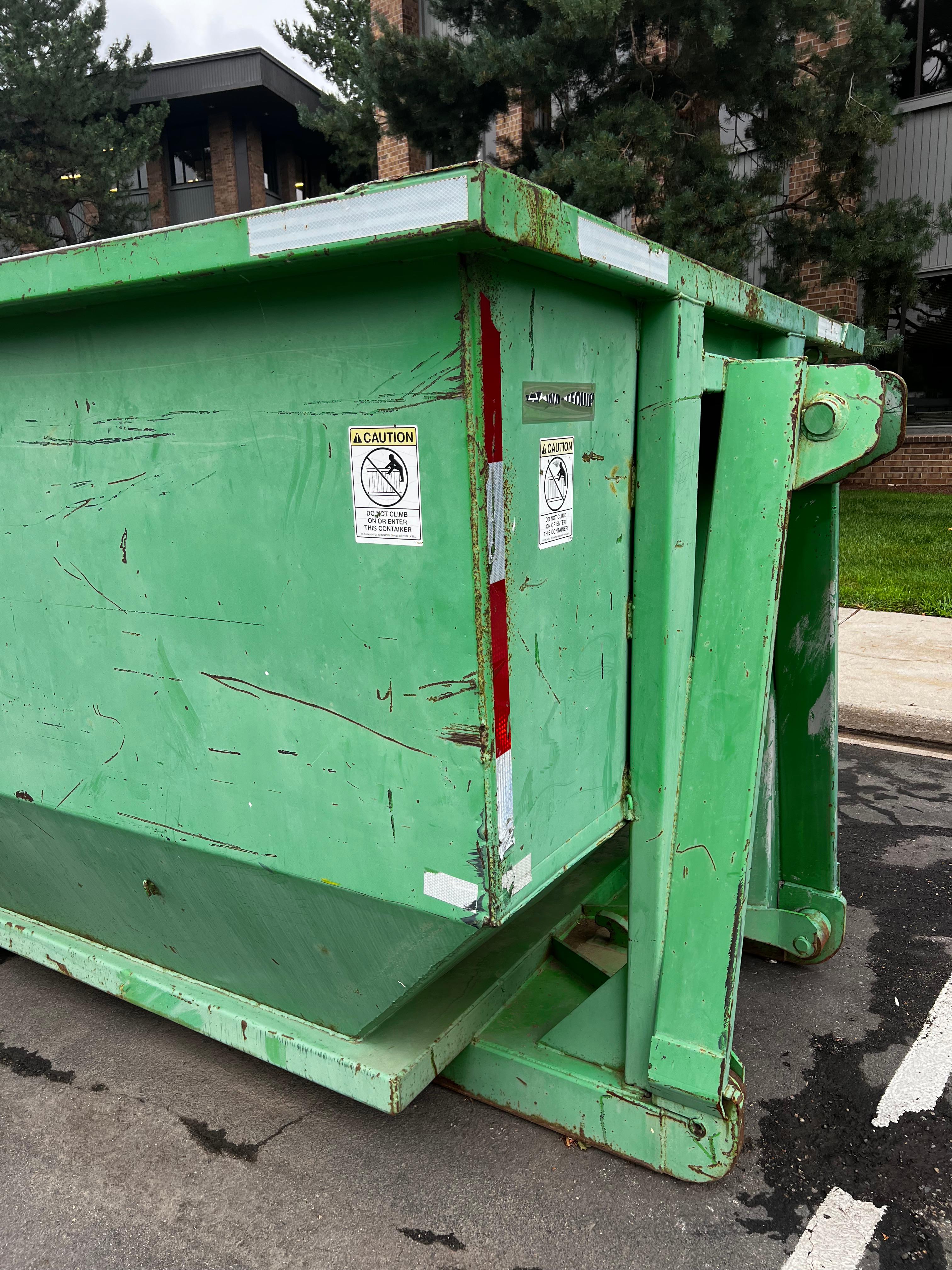 Green dumpster rental by Discount Dumpster