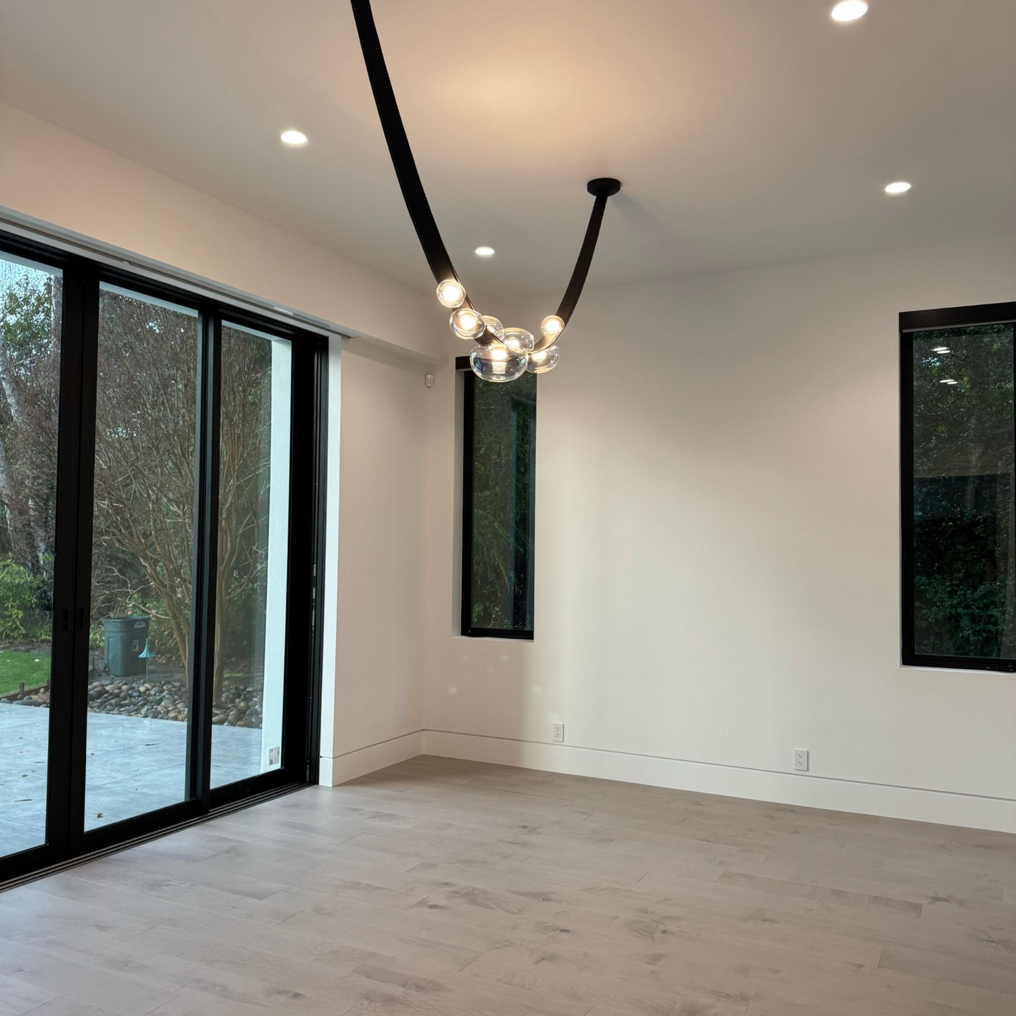Bright room with contemporary lighting.