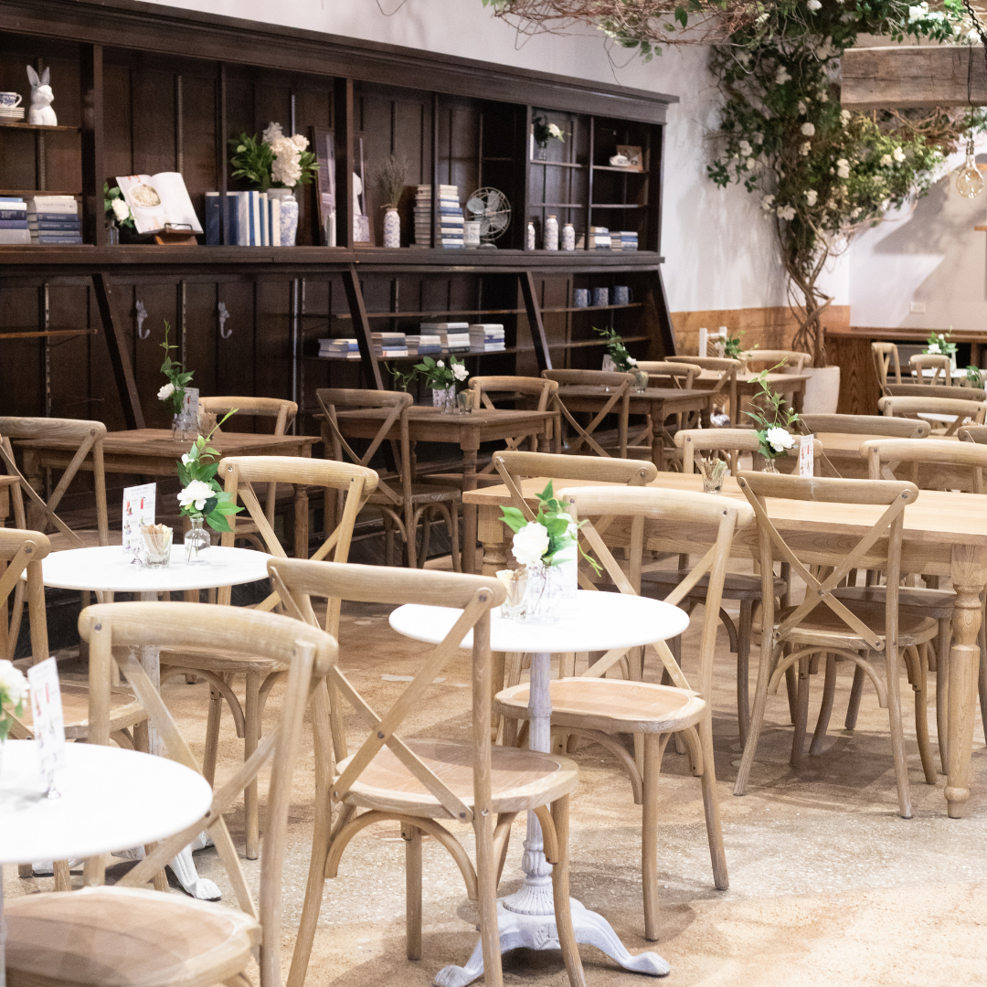 The image depicts a cozy café or bistro setting with wooden furniture and subtle decorative elements 