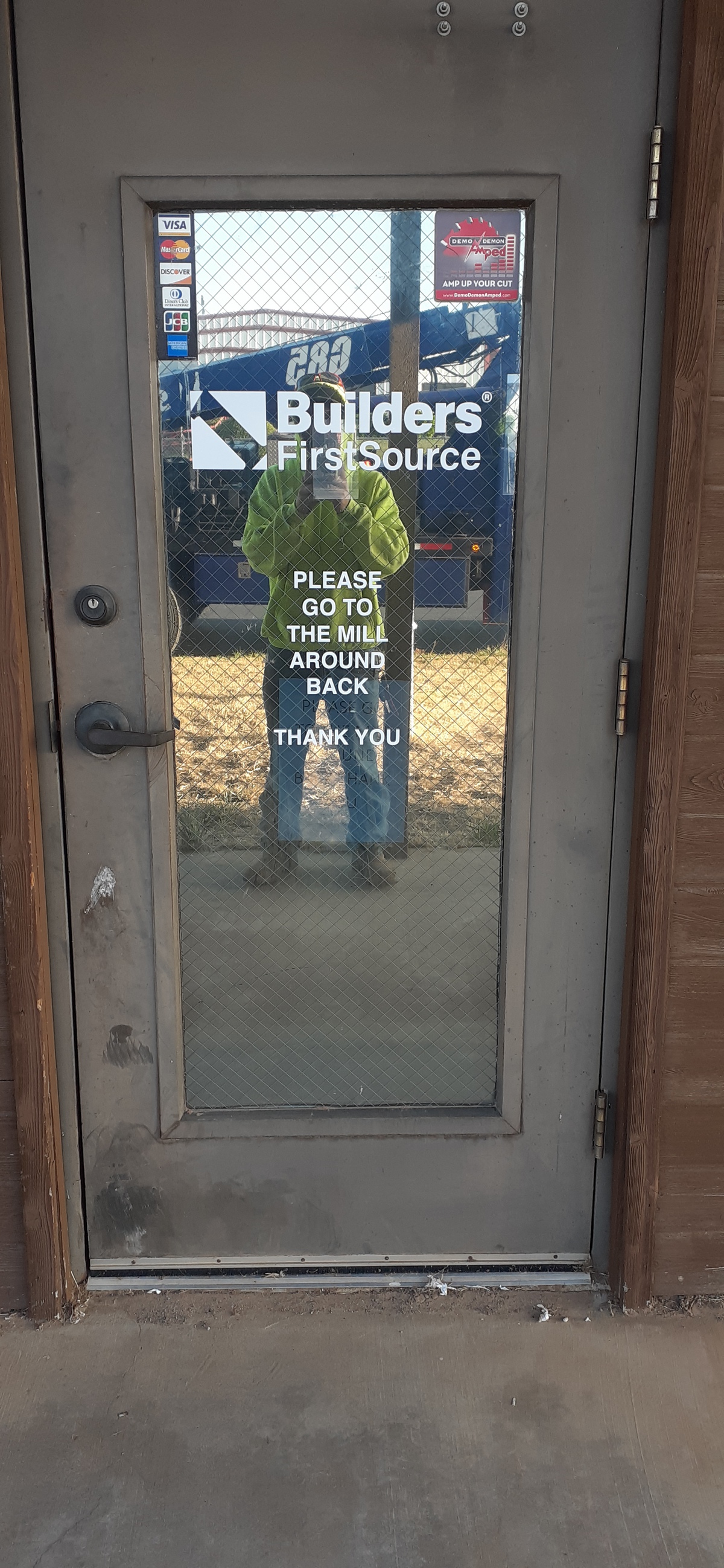 Builders FirstSource Building Materials Millwork Facility in Lubbock TX Door Sign.