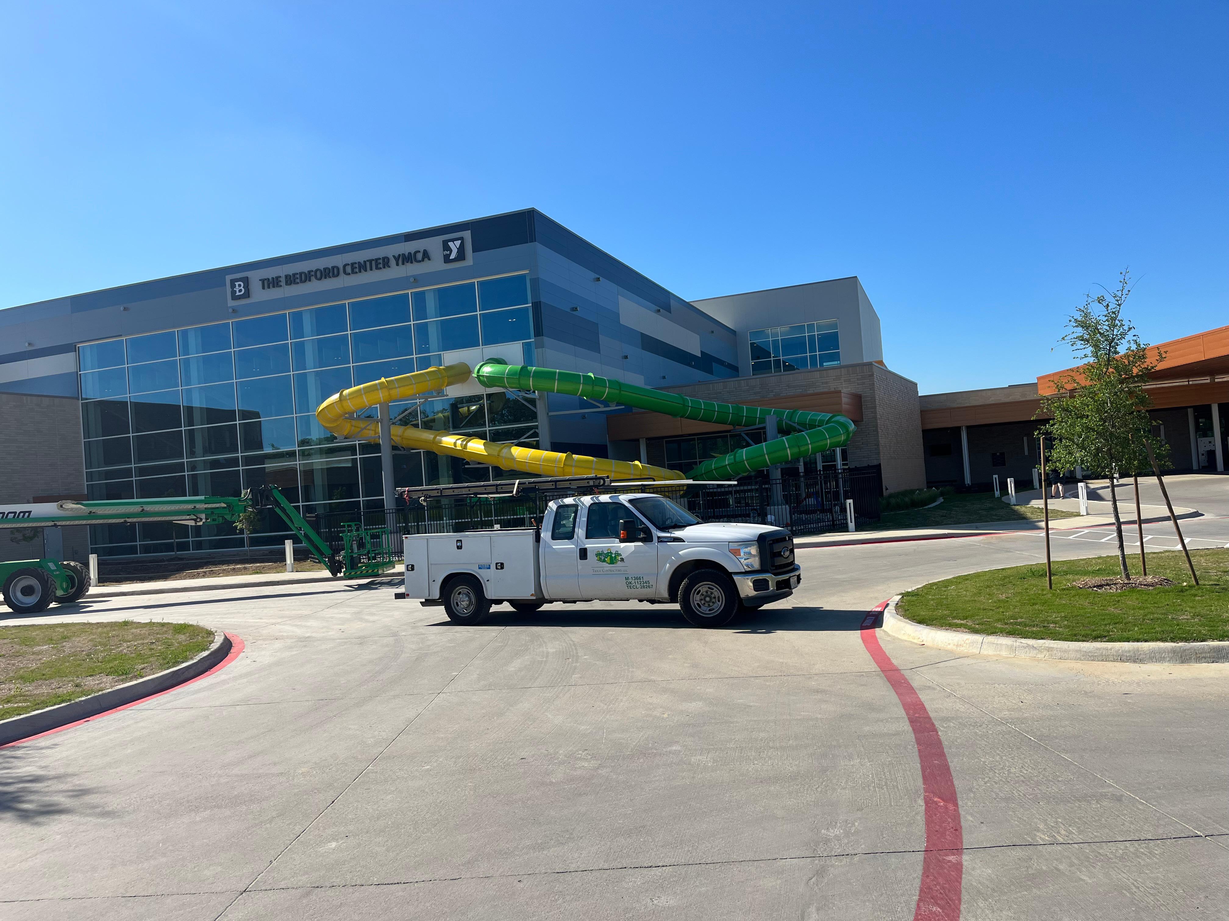 One of the Tioga Plumbing & Drain service trucks at The Bedford Center YMCA in Bedford Texas.