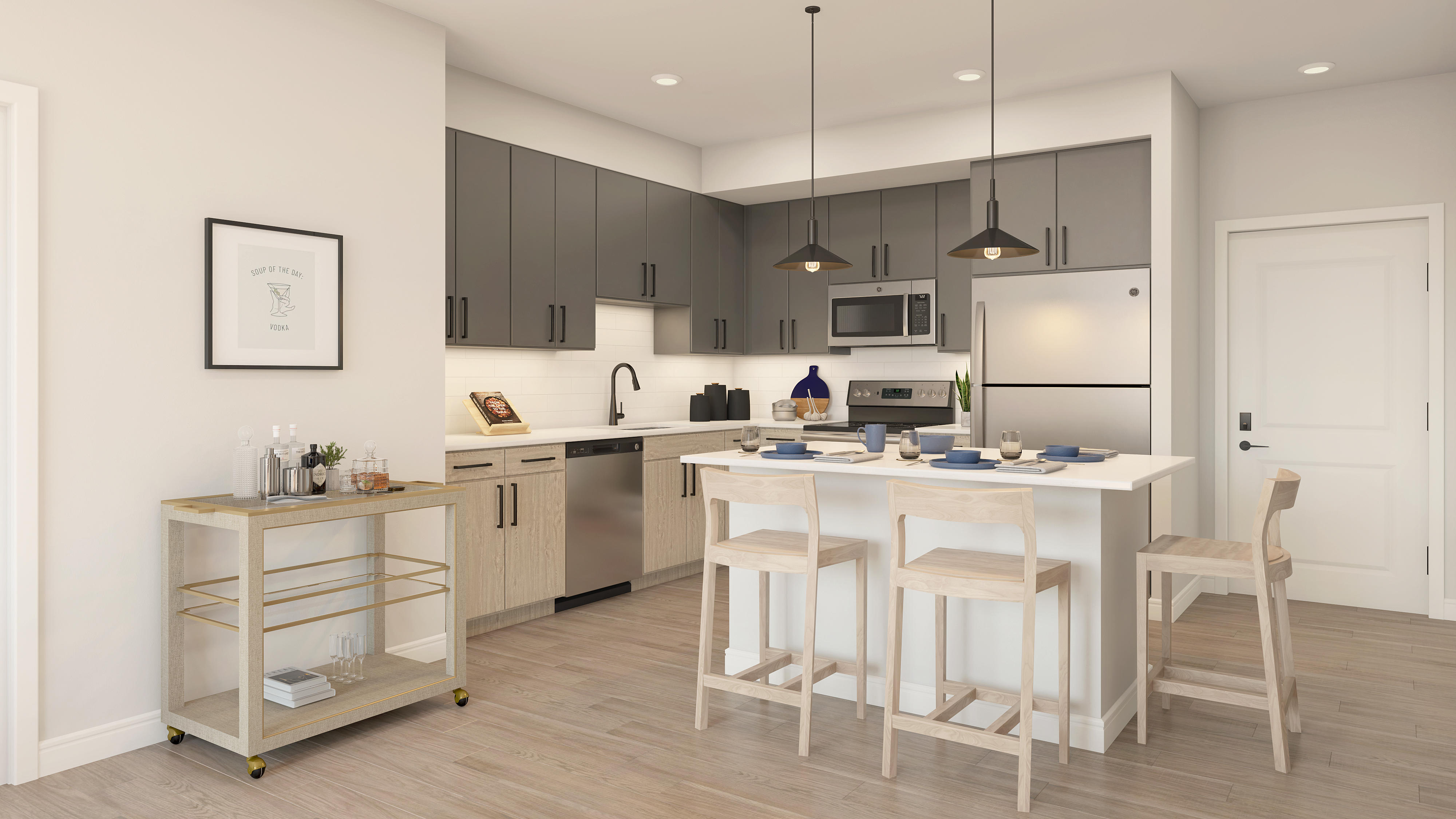 Apartment interior featuring chef-style kitchens with kitchen island, stainless steel appliances, dual-tone cabinetry and pendant lighting at The MARC luxury apartments in Palm Beach Gardens, FL