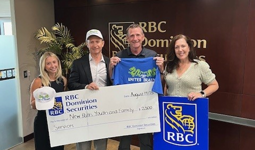 Members of The Madison Group presenting a giant cheque to New Path Foundation.