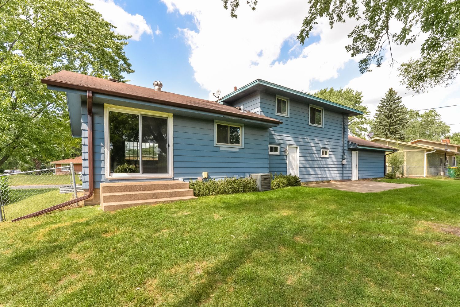 Spacious backyard with patio at Invitation Homes Minneapolis.